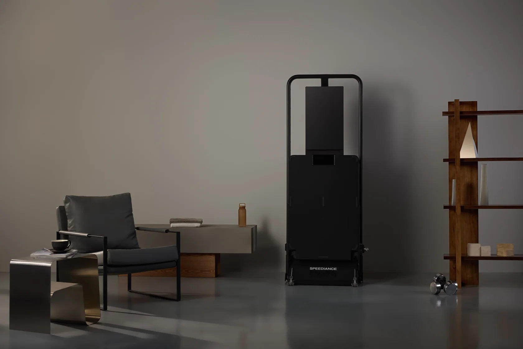 The entire folded Gym Monster 3 standing beside a chair in a living room
